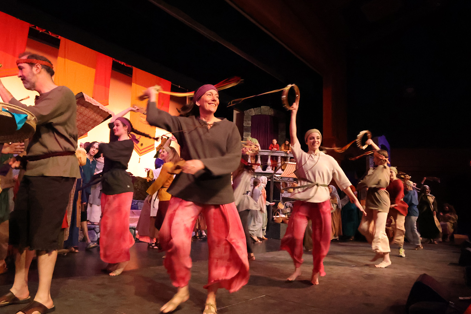 A group of dancers in a biblical temple.